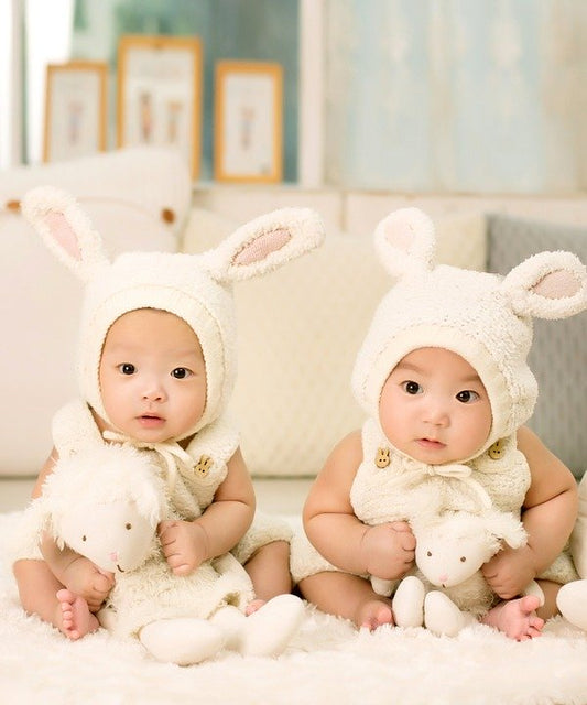 two babies in cute onesies