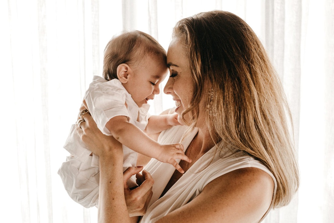 a mom holding her baby