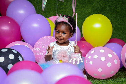 birthday girl wearing a cute baby outfit