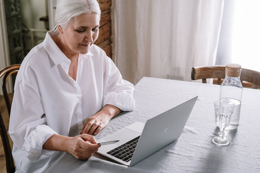a grandma searching for matching T-shirts for grandma and grandchild online