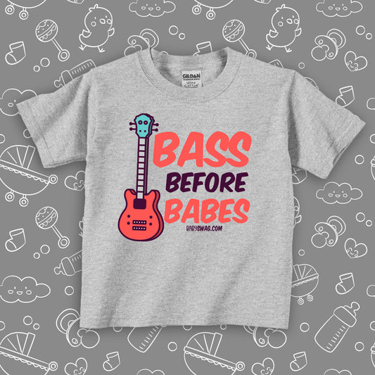 Toddler boy shirt with saying "Bass Before Babes" in grey.