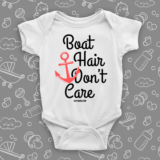Cute baby girl onesies with saying "Boat Hair Don't Care" in white.