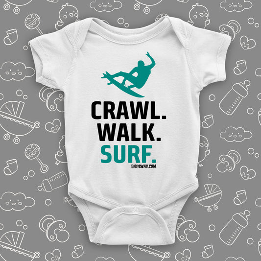 Unique baby boy onesies with saying: "Crawl. Walk. Surf" in white.