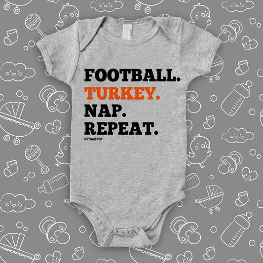 Cool baby onesies with saying "Football. Turkey. Nap. Repeat" in grey.