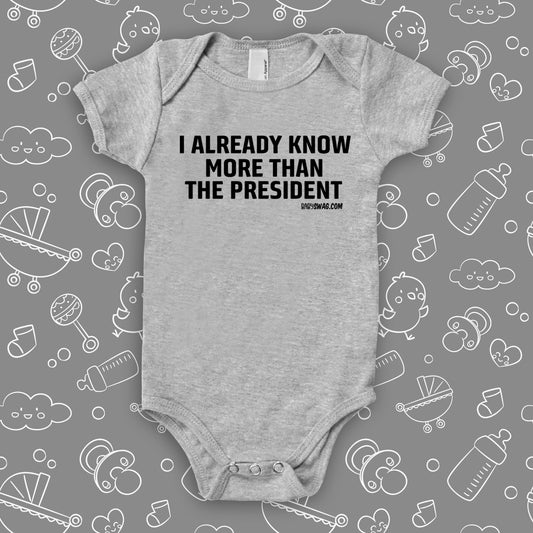 The ''I Already Know More Than The President' hilarious baby onesies in grey.