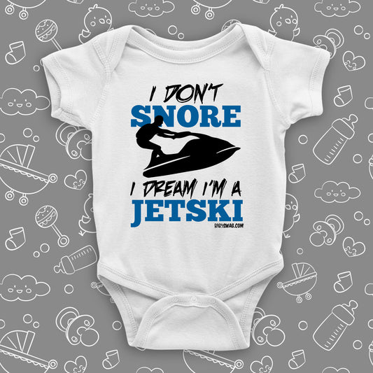 The ''I Don't Snore, I Dream I'm A Jetski'' funny baby onesies in white.