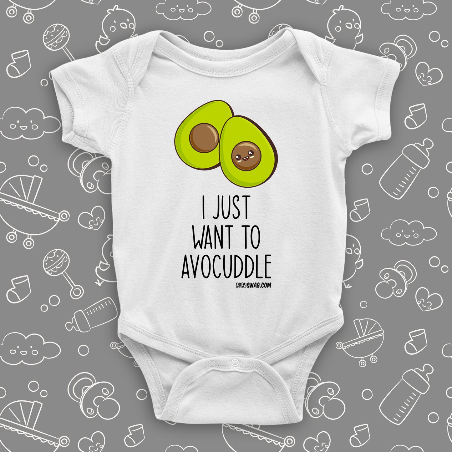 White cute baby onesie with an image of two halves of avocado and saying: "I just want to avocuddle".