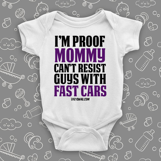 A white hilarious baby onesie sayng "I'm Proof Mommy Can't Resist Guys With Fast Cars"