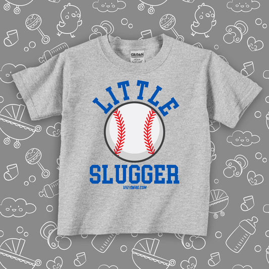 Toddler boy graphich tees with saying "Little Slugger" in grey.