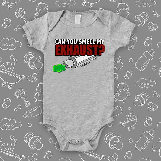 A grey hilarious baby onesies saying "Can You Smell My Exhaust"