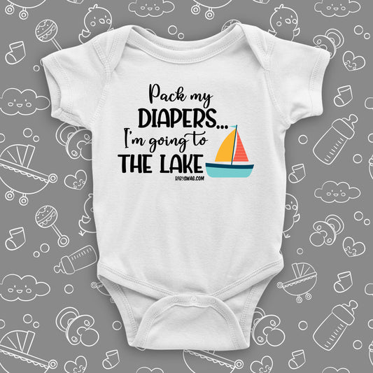 The ''Pack My Diapers, I'm Going To The Lake'' swag baby clothes in white.