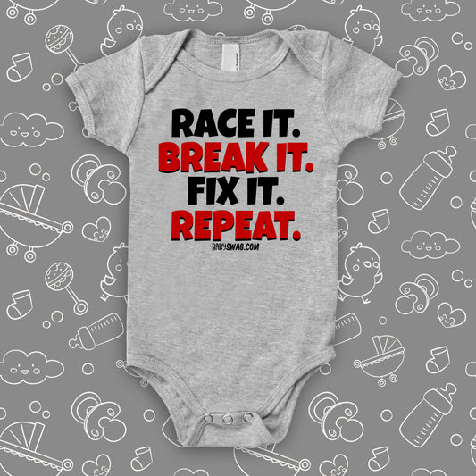 Unique baby boy onesie saying "Race It. Break It. Fix It. Repeat.", in grey.