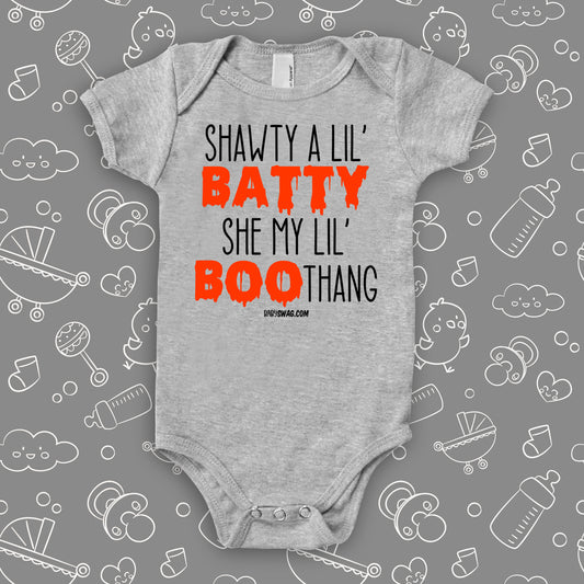 Cute baby onesies with saying "Shawty A Lil' Batty, She My Lil' Boo-thang" in grey.