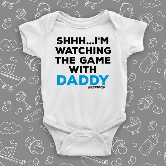 Cool toddler clothes with saying "Shh...I'm Watching The Game With Dad" in white.