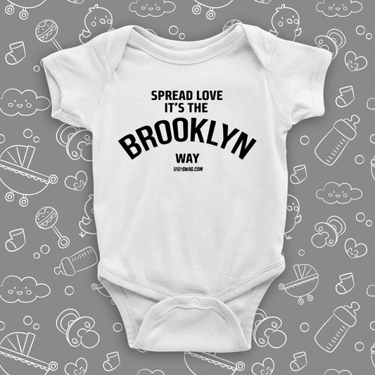 Cool baby onesies with saying "Spread Love, It's The Brooklyn Way" in white.