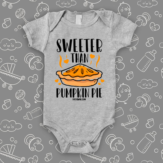 Cute baby onesies with saying "Sweeter Than Pumpkin Pie" in grey.