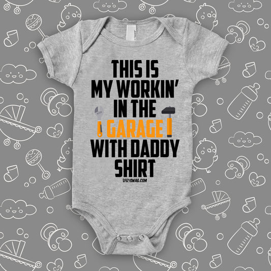Funny baby boy oneisie saying "This Is My Workin' In The Garage With Daddy Shirt" in grey.