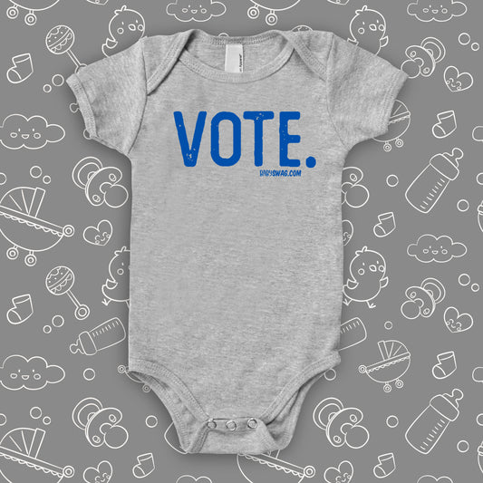 Grey baby onesie with a "Vote." print.