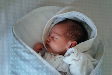 Do babies wear onesies under sleepers?