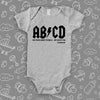 The rock n roll onesies with saying "ABCD" in grey
