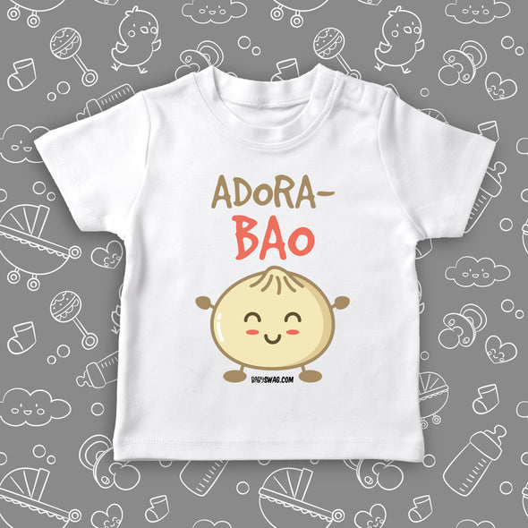Toddler graphic tee with "Adora-bao" print and an image of bao bun smiling, in white. 