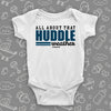 White cute baby onesie saying "All about that huddle weather".