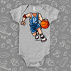 A basketball bobblehead cool baby boy onesie in grey.
