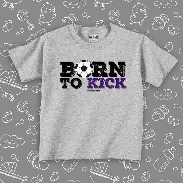 The "Born To Kick" toddler boy shirt in grey with soccer ball print. 