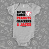 Cute baby onesies with saying "Buy Me Some Peanuts, Crackers & Jacks" in grey. 