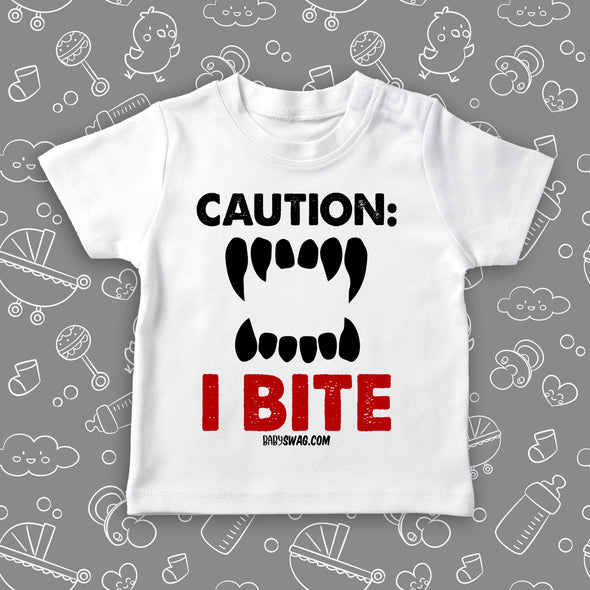 Toddler graphic tee with saying "Caution: I Bite" in white. 