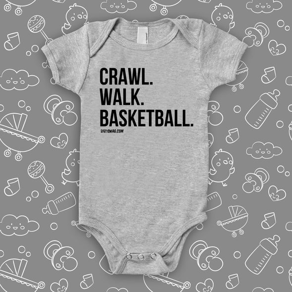 Cute baby boy onesies with saying "Crawl. Walk. Basketball" in grey. 