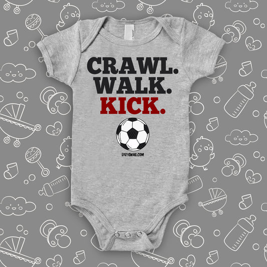 baby boy onesies with the caption "Crawl. Walk. Kick" in grey.