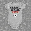 baby boy onesies with the caption "Crawl. Walk. Kick" in grey. 