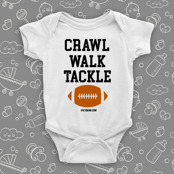 The "Crawl. Walk. Tackle" cute baby onesies in white.