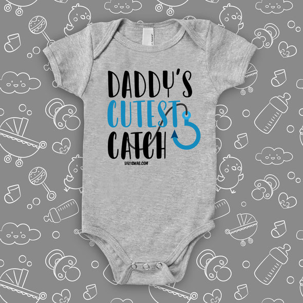 The "Daddy's Cutest Catch" cute baby onesies in grey. 