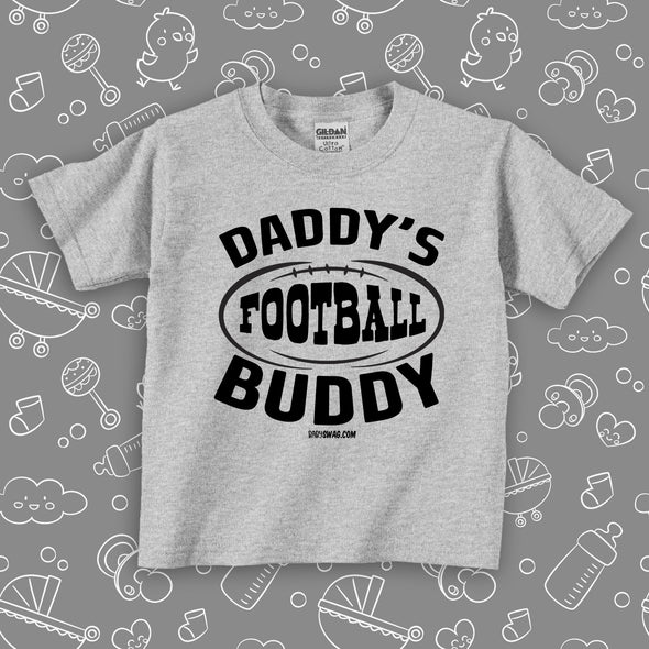 Toddler boy graphic tees with saying "Daddy's Football Buddy" in grey. 