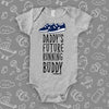 Cute baby onesies with saying "Daddy's Future Running Buddy" in grey.