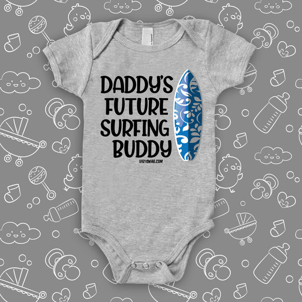 The ''Daddy's Future Surfing Buddy'' baby boy onesie sayings on badass baby clothes in grey.