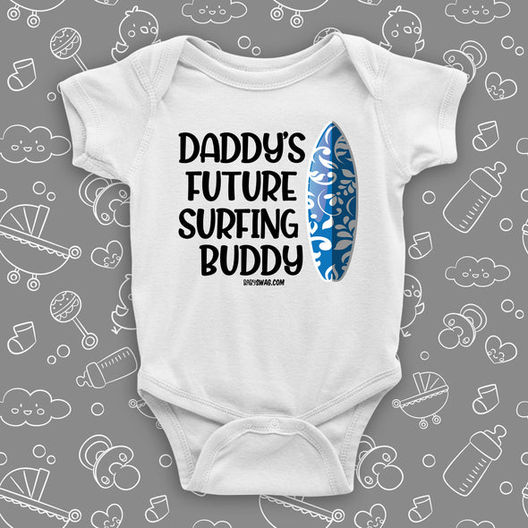 The ''Daddy's Future Surfing Buddy'' baby boy onesie sayings on badass baby clothes in white.