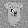 The ''Don't Touch My Rolls'' cool baby onesie in grey. 