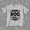 Toddler graphic tees with saying "Every Dog Need A Baby" in grey. 