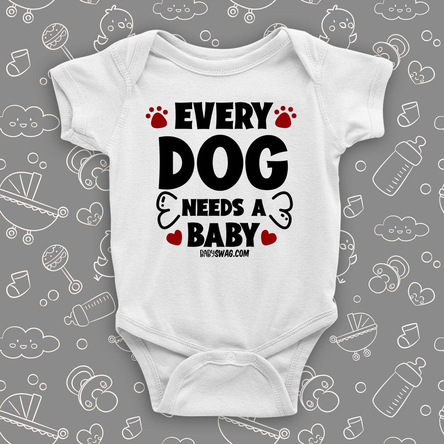 White cute baby onesie saying "Every dog needs a baby", red paws and bone also printed.