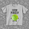 Grey todder graphic tee saying "Everyday I'm Brusselin'" and a drawing of a Brussel sprout with arms and legs. 