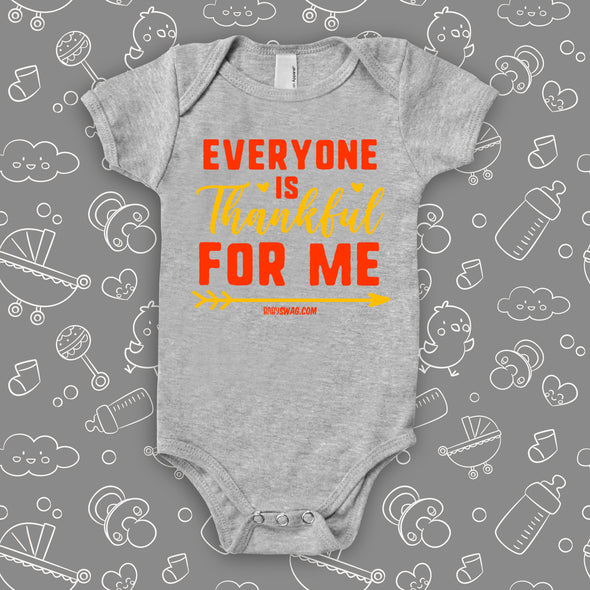 Cute baby onesies with saying "Everyone Is Thankful For Me" in grey. 