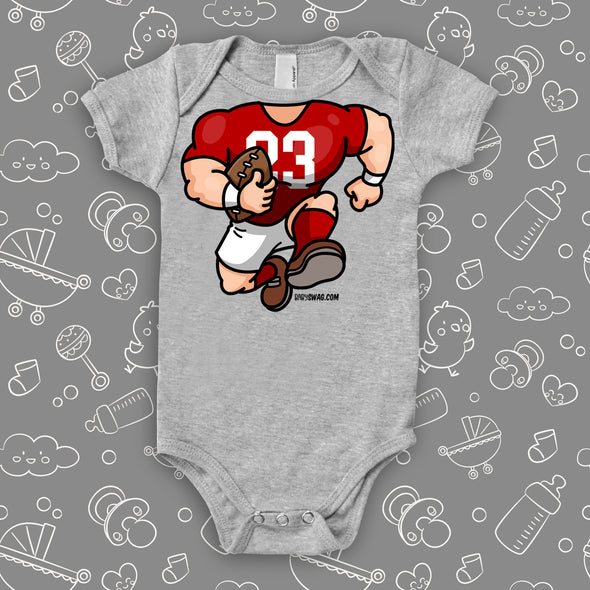  A grey baby boy onesie with football bobblehead