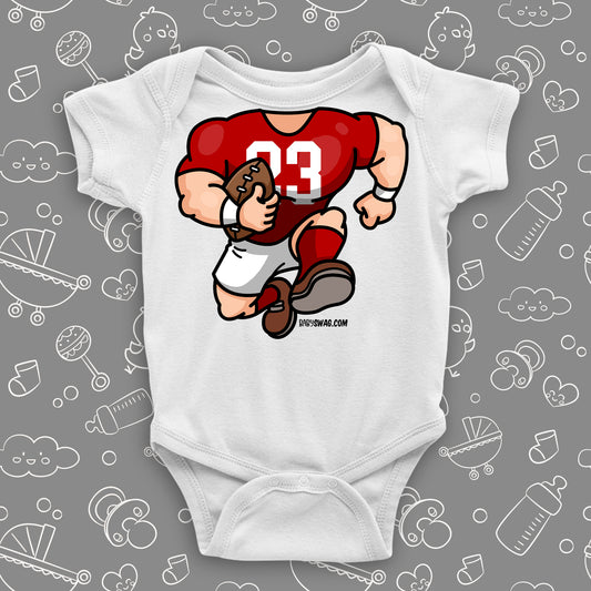 A white baby boy onesie with football bobblehead.