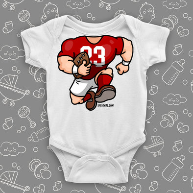 A white baby boy onesie with football bobblehead.