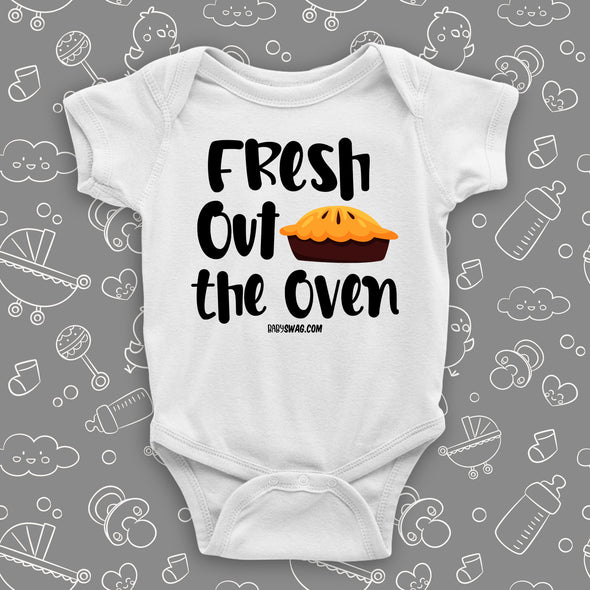 Cute baby onesies with saying "Fresh Out The Oven" in white.