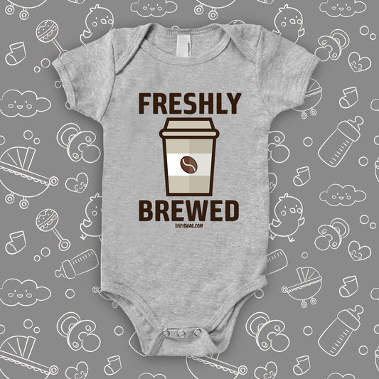 Grey cool baby onesie with "Freshly brewed" print and an image of a coffee-to-go cup.