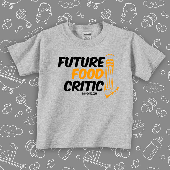 White funny toddler graphic tee saying "Future Food Critic", color grey.